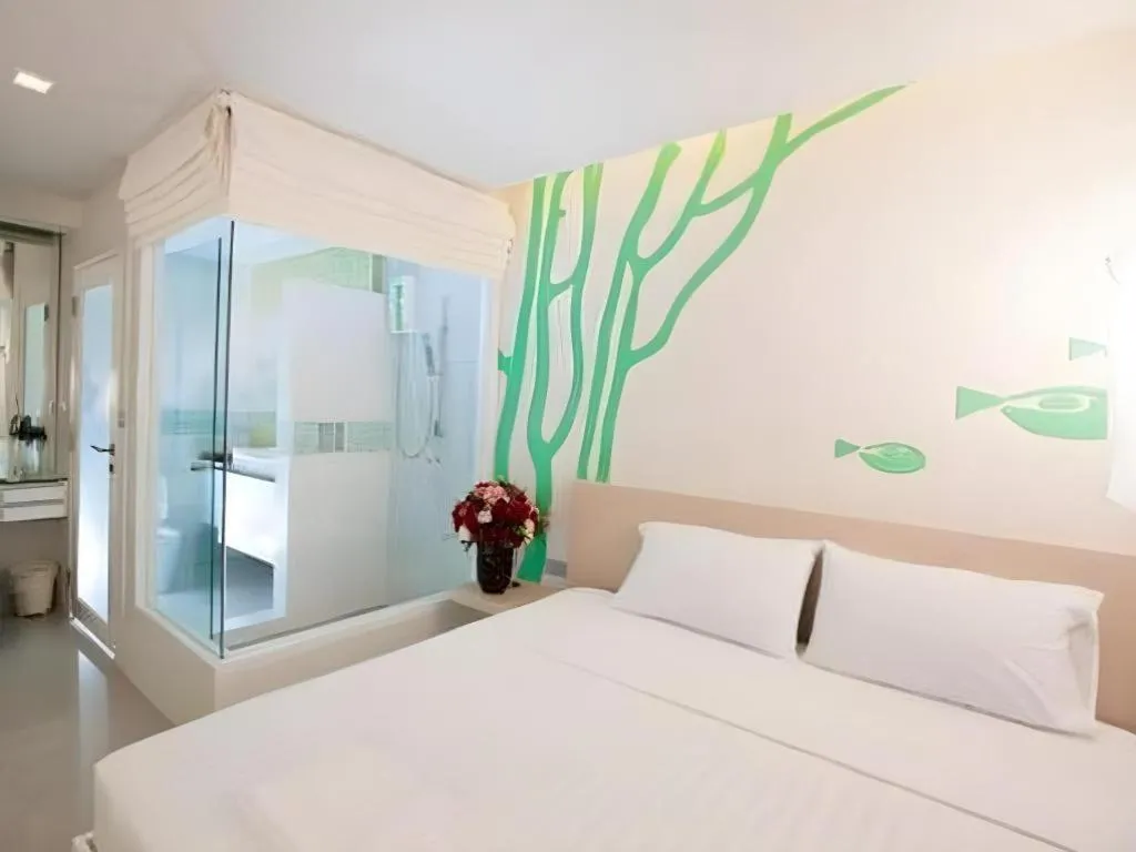 Bed in R-Con Blue Ocean Hotel