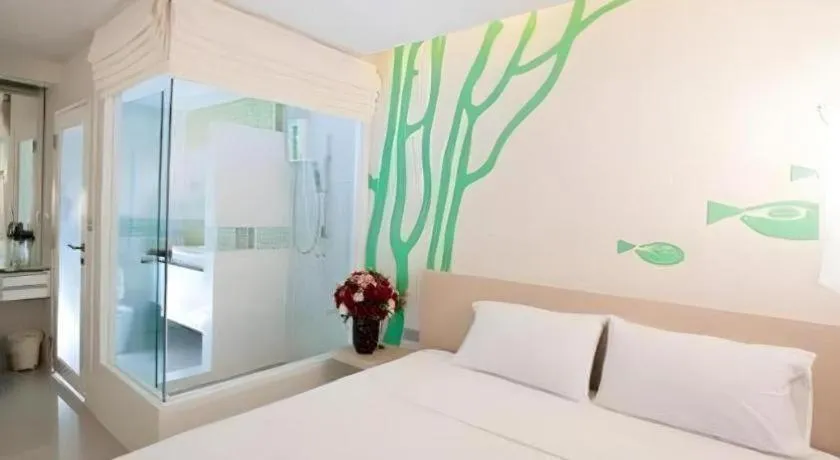 Bed in R-Con Blue Ocean Hotel