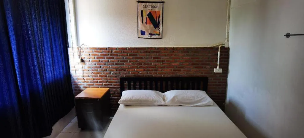 Bed in Chinawat Hotel