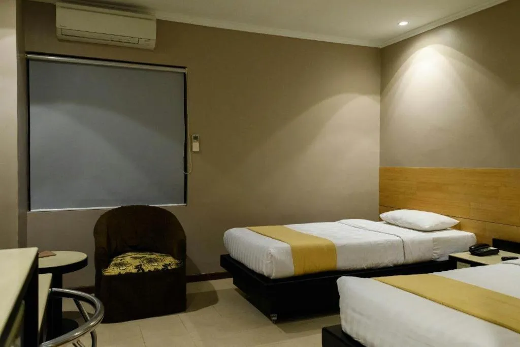 Bed in Gajahmada Avara Boutique Hotel