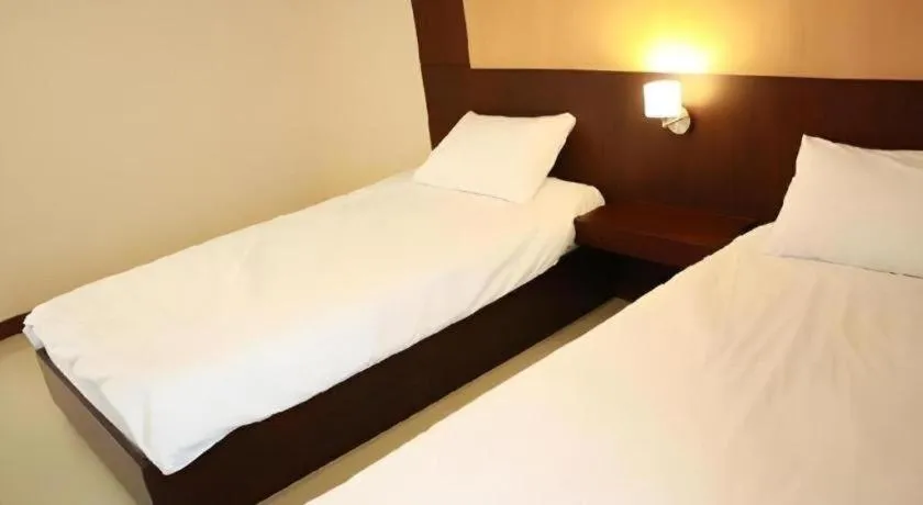 Bed in 777Bliss Hometel