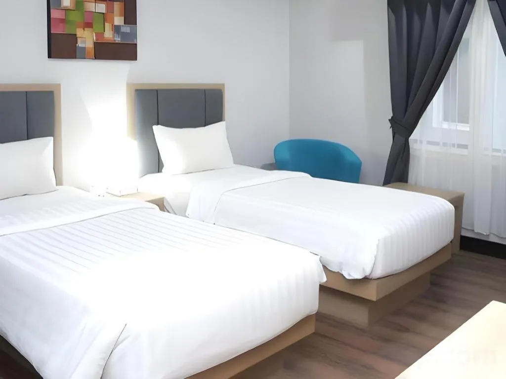 Bed in Orchardz Hotel Gajah Mada