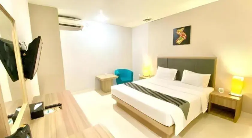 Bed in Orchardz Hotel Gajah Mada Bed in Orchardz Hotel Gajah Mada