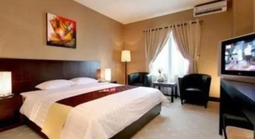 Bed in Orchardz Hotel Gajah Mada Bed in Orchardz Hotel Gajah Mada