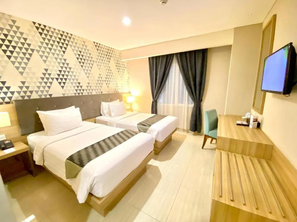 Bed in Orchardz Hotel Gajah Mada