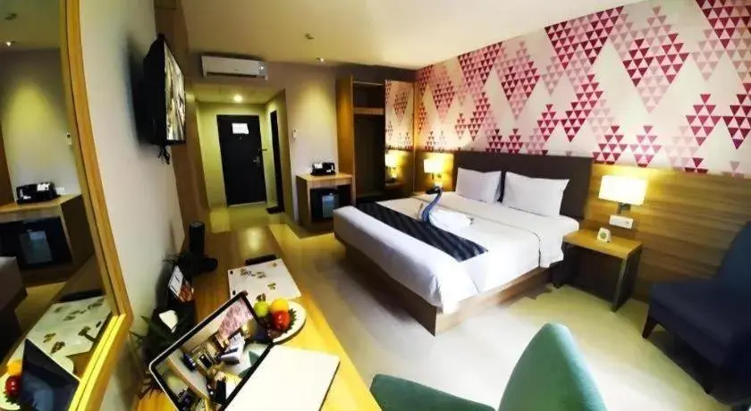 Bed in Orchardz Hotel Gajah Mada Bed in Orchardz Hotel Gajah Mada