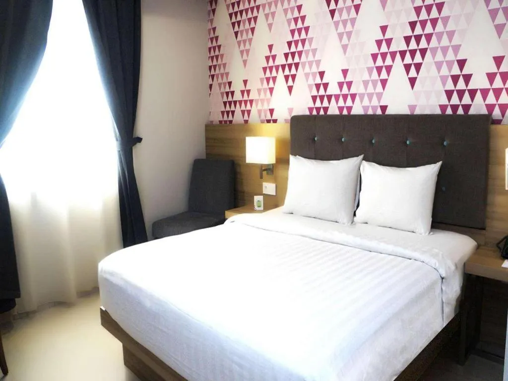 Bed in Orchardz Hotel Gajah Mada