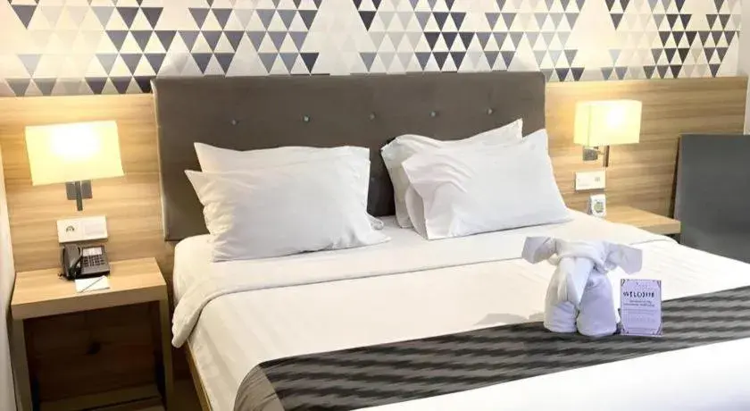 Bed in Orchardz Hotel Gajah Mada Bed in Orchardz Hotel Gajah Mada