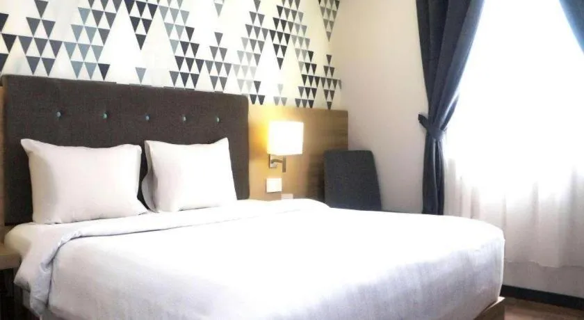 Bed in Orchardz Hotel Gajah Mada