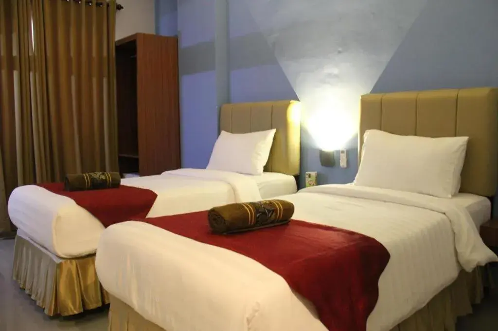 Bed in Garuda Hotel Pontianak Bed in Garuda Hotel Pontianak