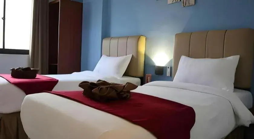 Bed in Garuda Hotel Pontianak Bed in Garuda Hotel Pontianak