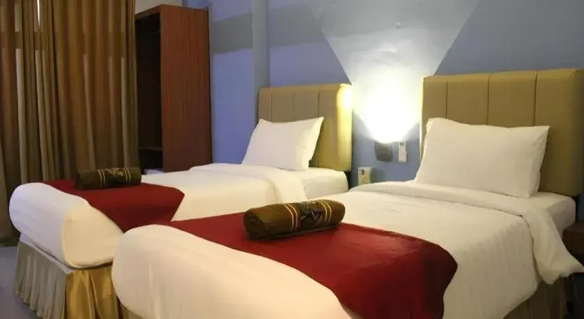 Bed in Garuda Hotel Pontianak Bed in Garuda Hotel Pontianak