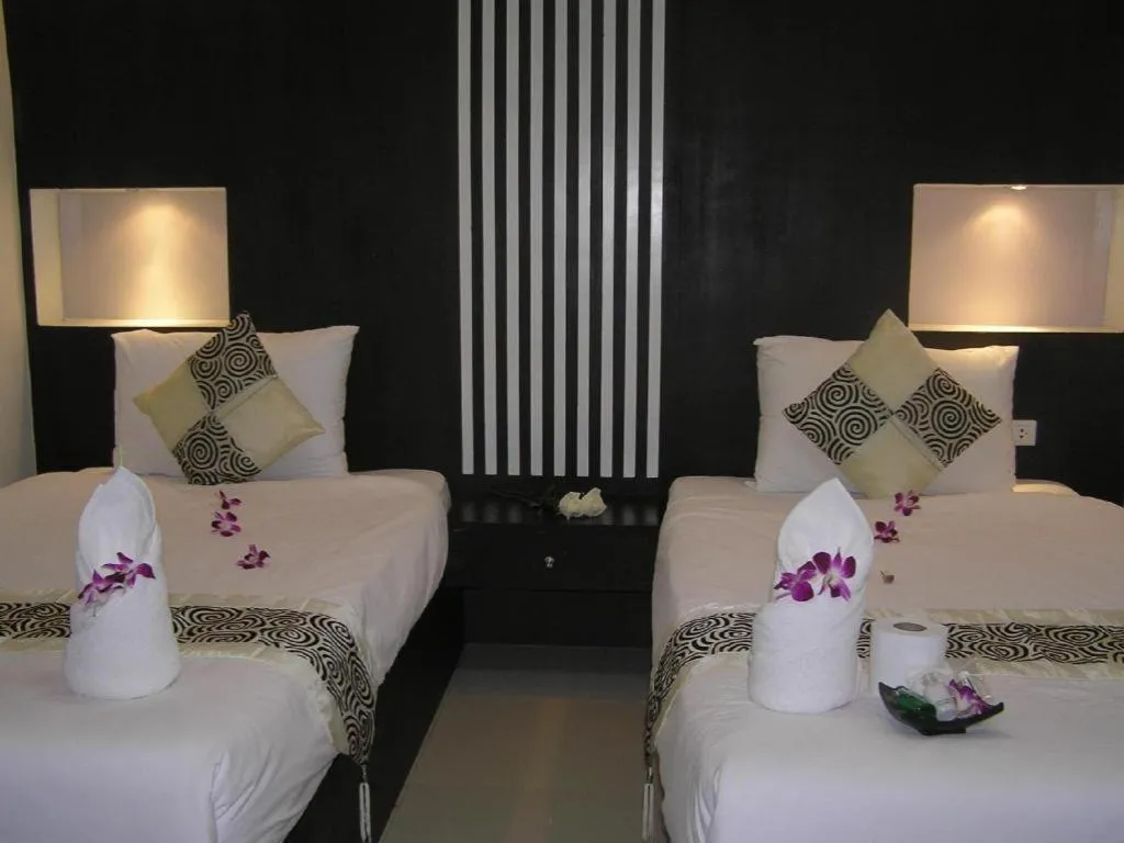 Bed in The Impress Khonkaen Hotel