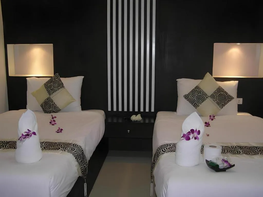 Bed in The Impress Khonkaen Hotel