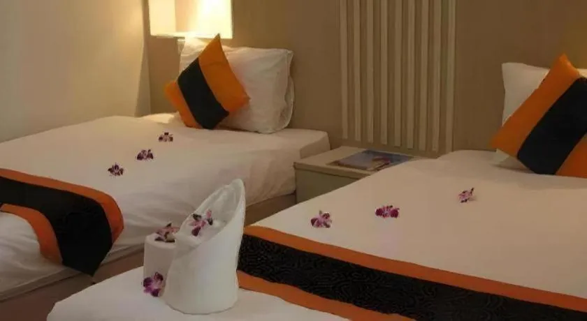 Bed in The Impress Khonkaen Hotel