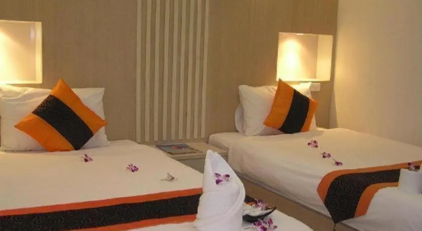 Bed in The Impress Khonkaen Hotel