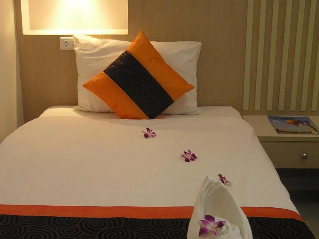Bed in The Impress Khonkaen Hotel