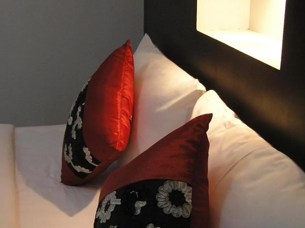 Bed in The Impress Khonkaen Hotel