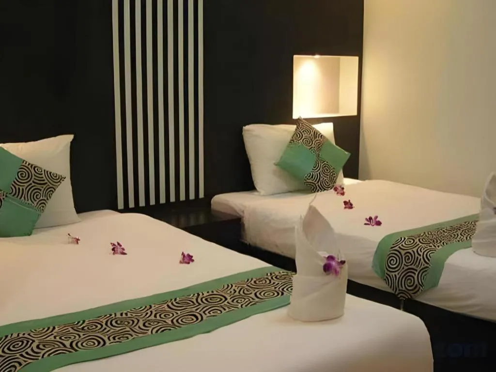 Bed in The Impress Khonkaen Hotel