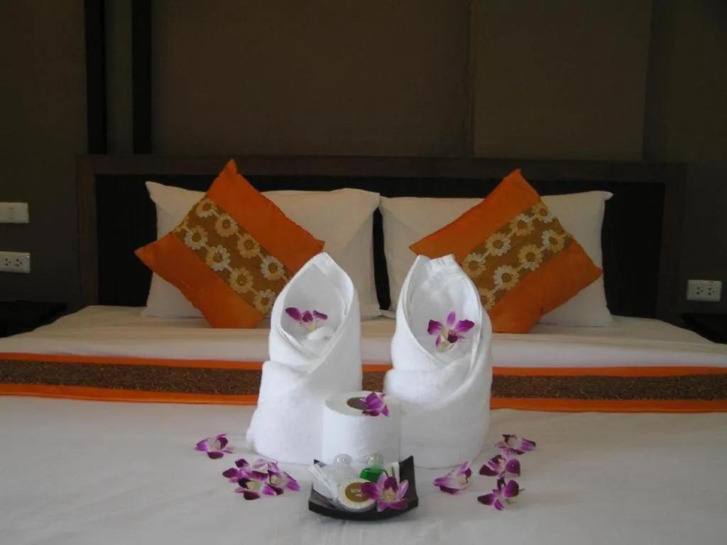 Bed in The Impress Khonkaen Hotel