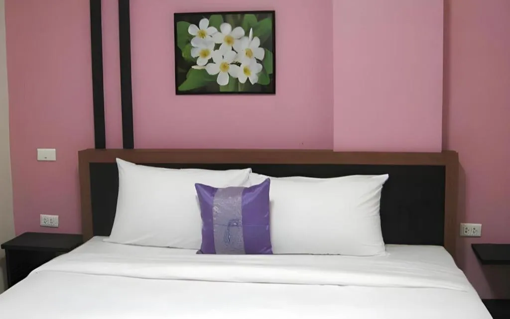 Bed in The Impress Khonkaen Hotel