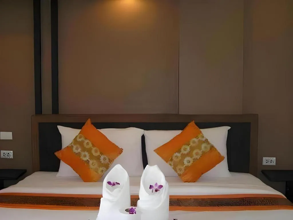 Bed in The Impress Khonkaen Hotel