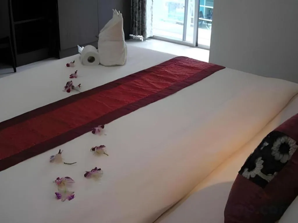 Bed in The Impress Khonkaen Hotel