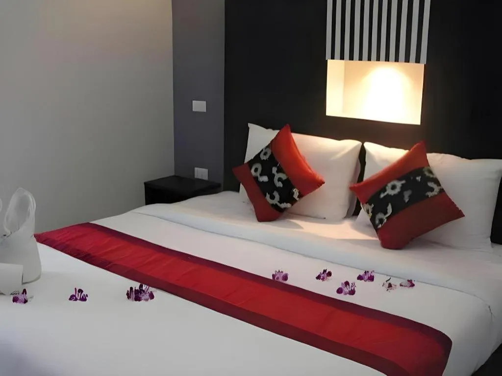 Bed in The Impress Khonkaen Hotel