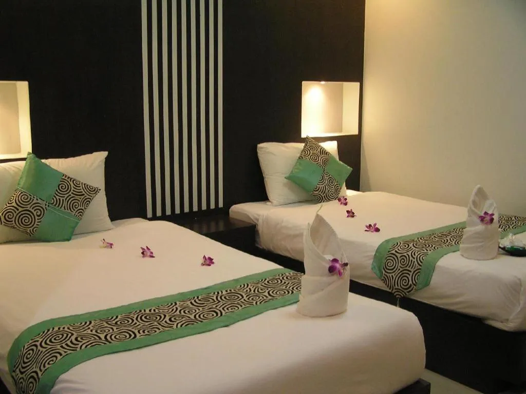 Bed in The Impress Khonkaen Hotel