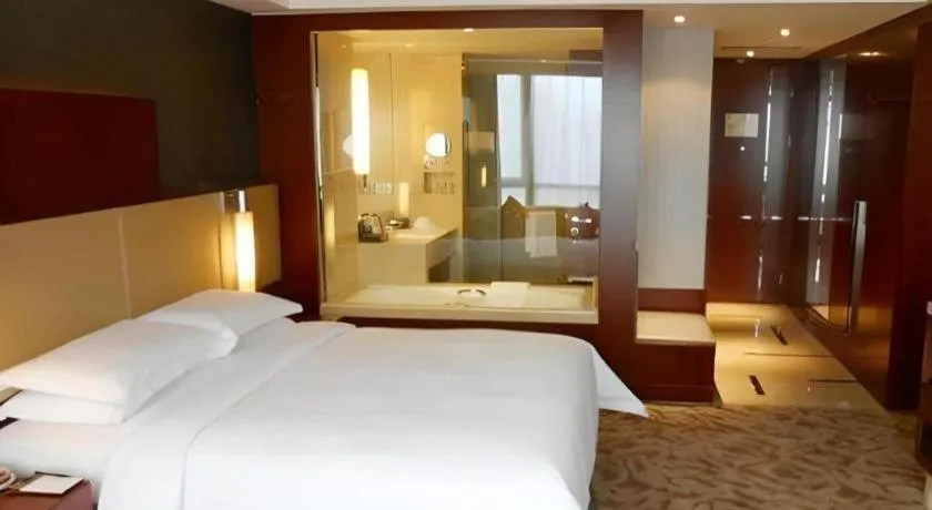 Bed in Kun Tai Glory Hotel Beijing Wangjing