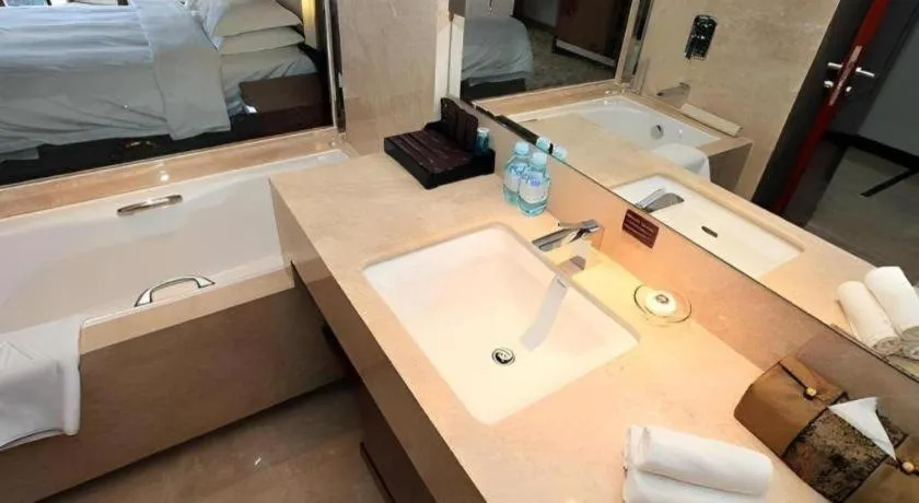 Bed in Kun Tai Glory Hotel Beijing Wangjing