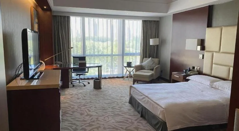 Bed in Kun Tai Glory Hotel Beijing Wangjing