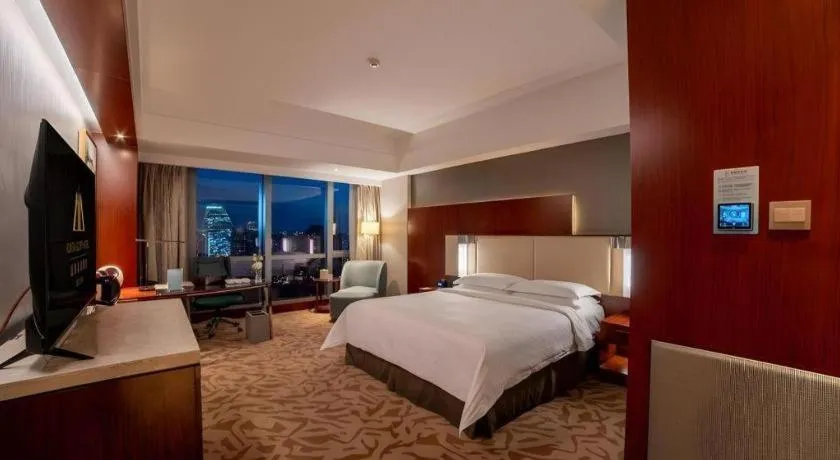 Bed in Kun Tai Glory Hotel Beijing Wangjing