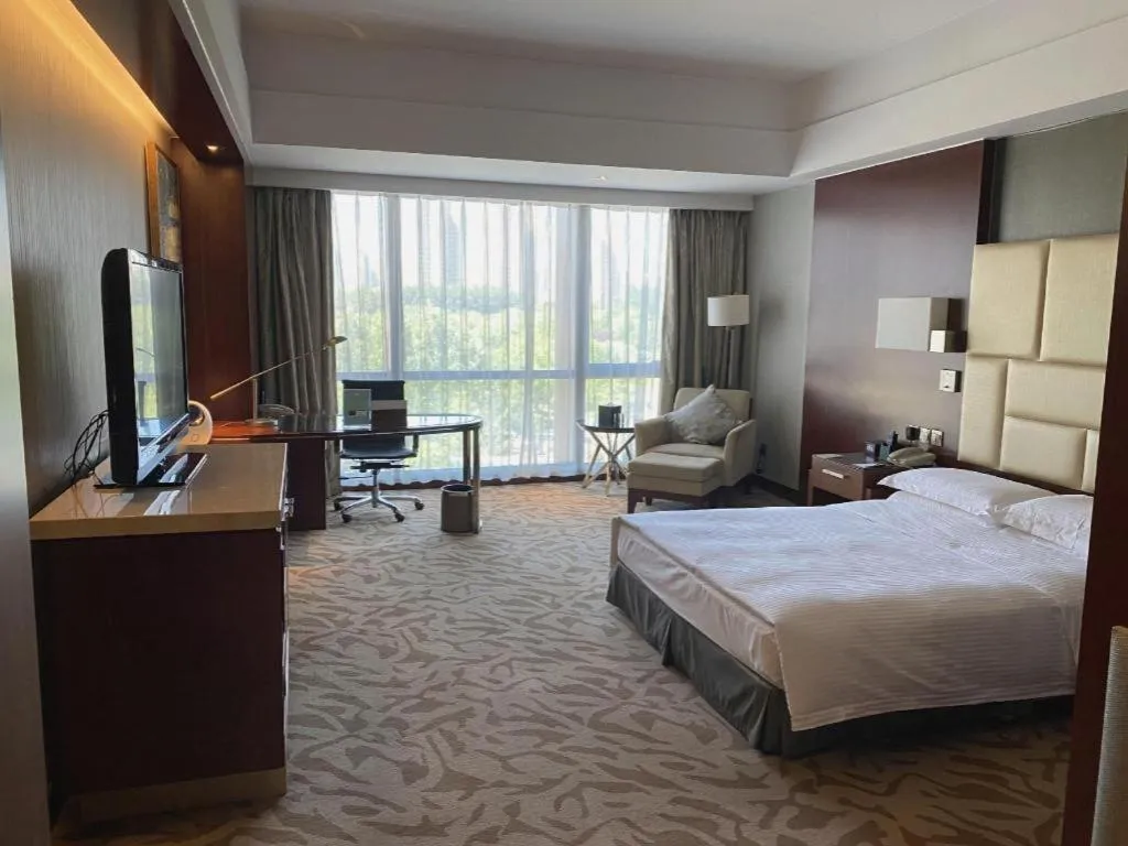 Bed in Kun Tai Glory Hotel Beijing Wangjing