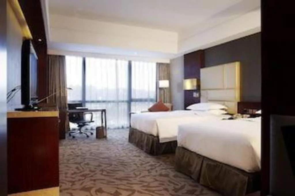 Bed in Kun Tai Glory Hotel Beijing Wangjing