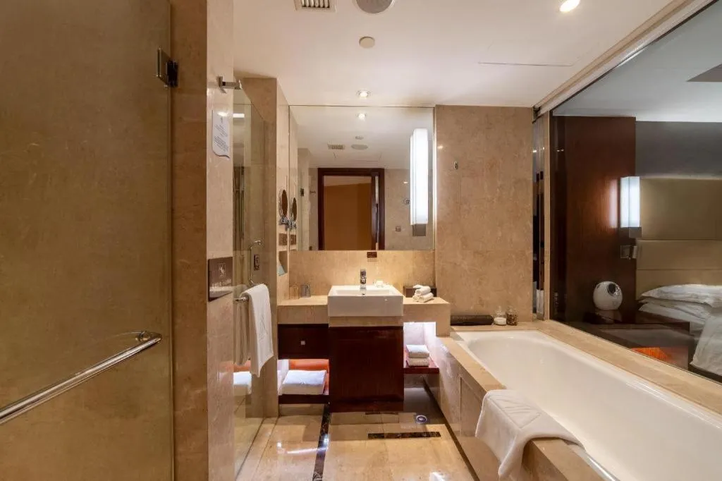 Bed in Kun Tai Glory Hotel Beijing Wangjing