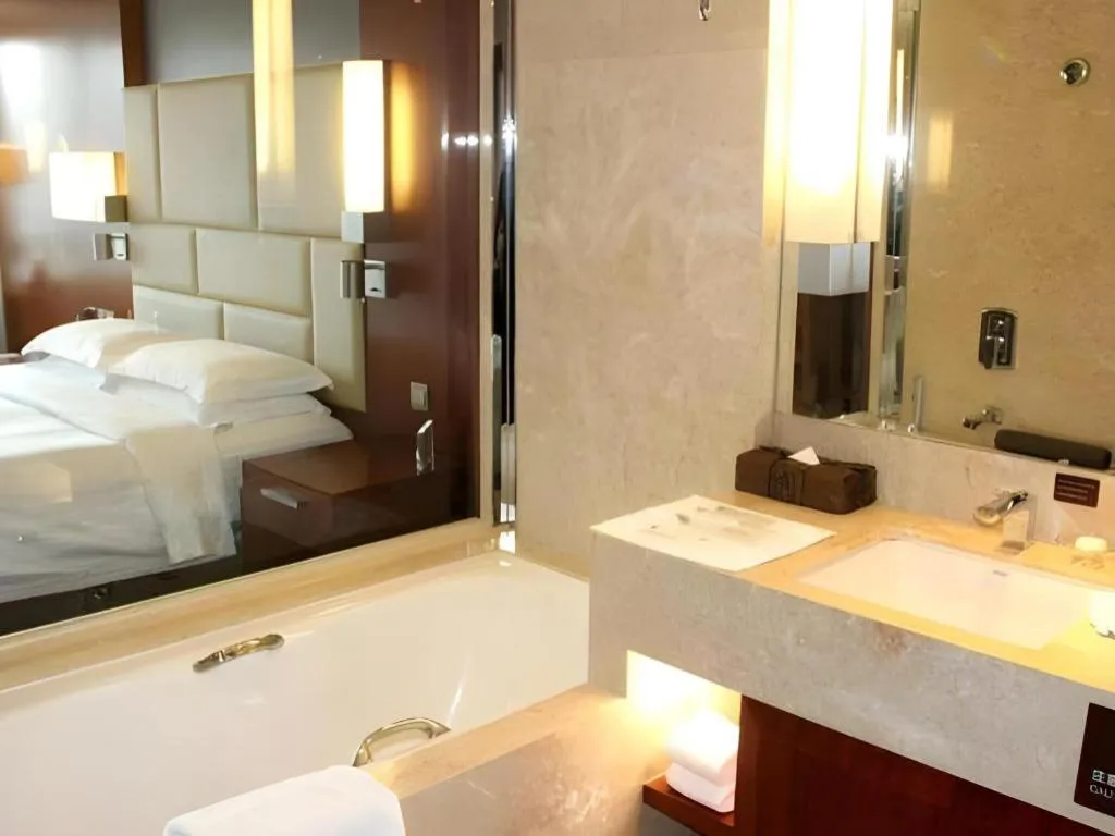 Bed in Kun Tai Glory Hotel Beijing Wangjing