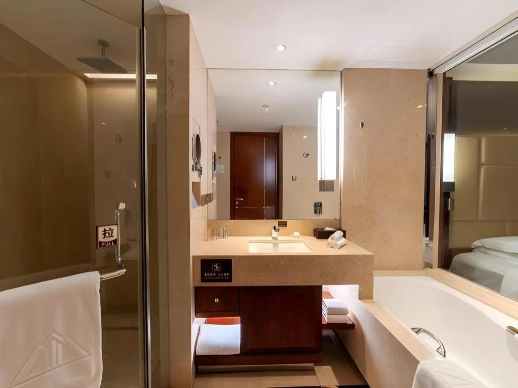 Bed in Kun Tai Glory Hotel Beijing Wangjing