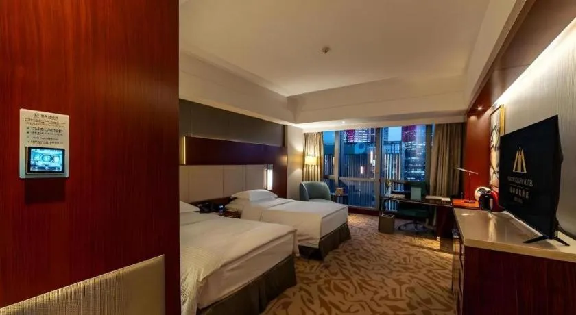 Bed in Kun Tai Glory Hotel Beijing Wangjing