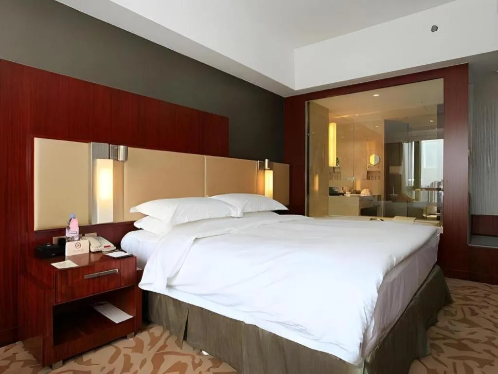 Bed in Kun Tai Glory Hotel Beijing Wangjing