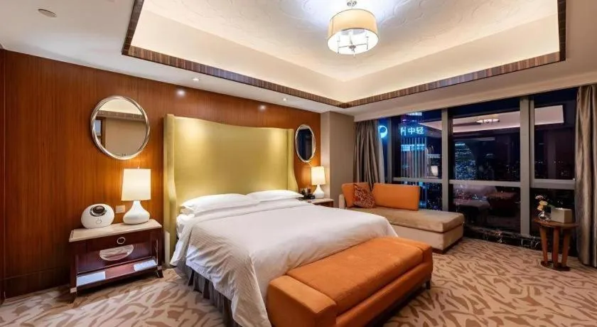 Bed in Kun Tai Glory Hotel Beijing Wangjing