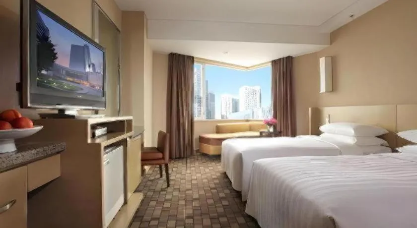 Bed in Kun Tai Glory Hotel Beijing Wangjing