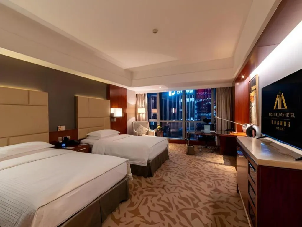 Bed in Kun Tai Glory Hotel Beijing Wangjing