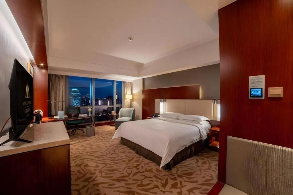 Bed in Kun Tai Glory Hotel Beijing Wangjing