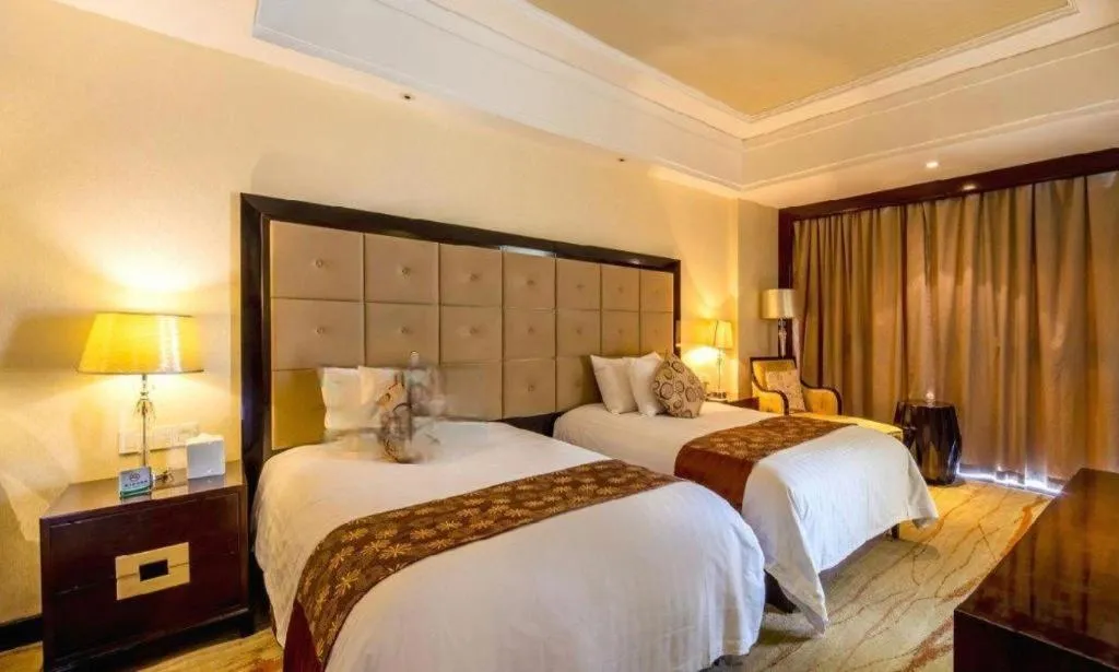 Bed in New Century Grand Hotel Xinxiang