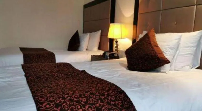 Bed in New Century Grand Hotel Xinxiang