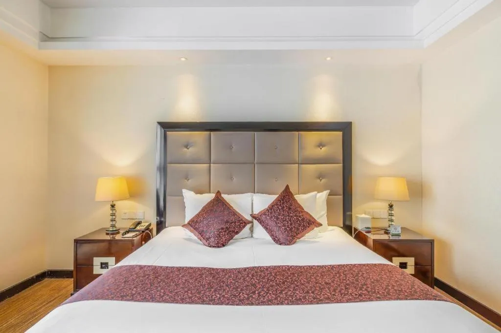 Bed in New Century Grand Hotel Xinxiang