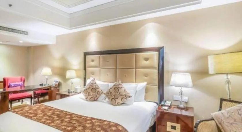 Bed in New Century Grand Hotel Xinxiang