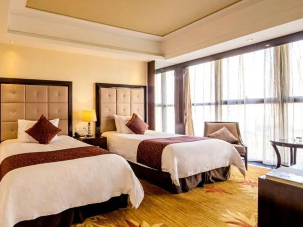 Bed in New Century Grand Hotel Xinxiang