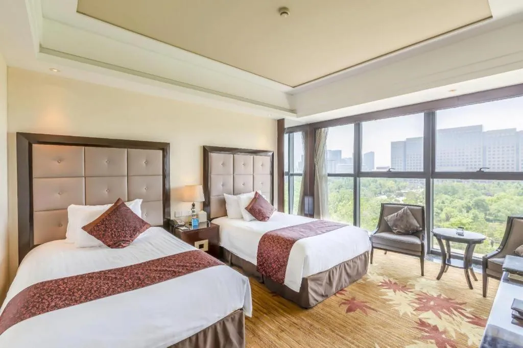 Bed in New Century Grand Hotel Xinxiang